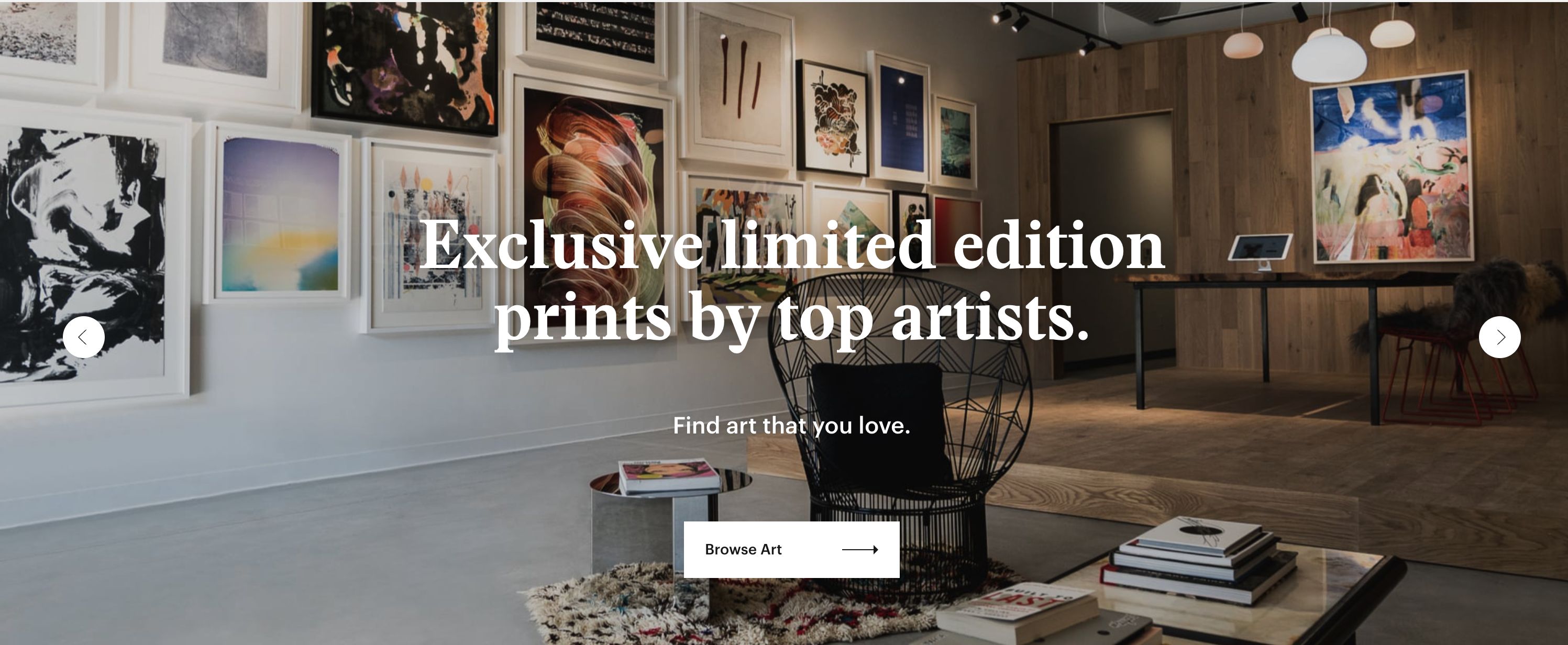 Archived Twyla storefront hero showing framed contemporary art in a gallery-like room beneath the headline Exclusive limited edition prints by top artists.